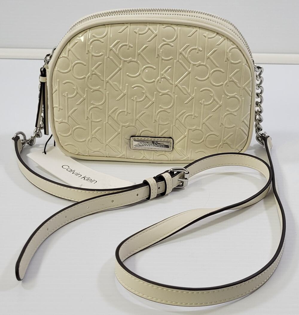 AA) Calvin Klein Takara Crossbody Faux Leather Vinyl Monogram White Shoulder Bag